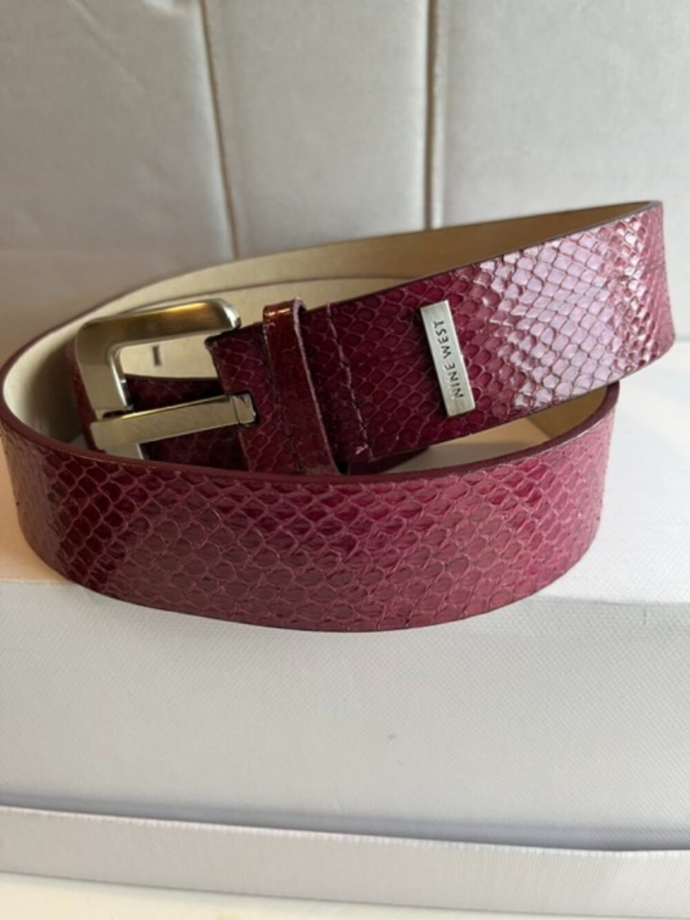 Nine West burgundy textured leather belt.